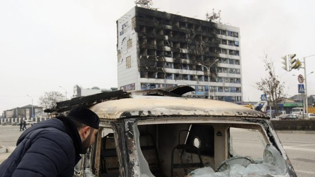 Battered building: The 10-storey publishing house in central Grozny that was seized by militants.