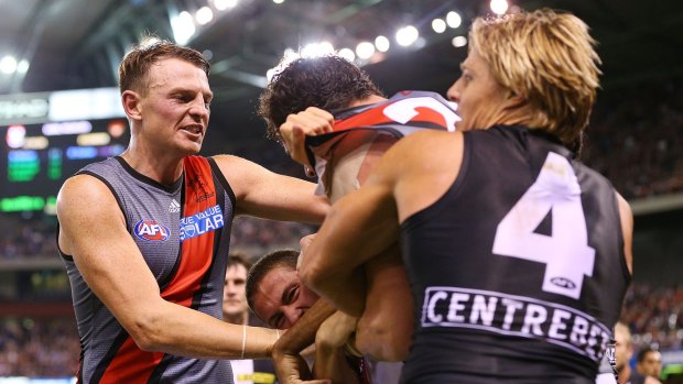 A melee breaks out as Brendon Goddard tries to get teammate Jake Carlisle away from Clinton Jones of the Saints.