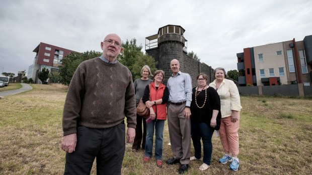 From left to right, opponents to the apartment block proposed to be built behind this guard tower at the former Pentridge prison: Michael Hamel-Green, Coucillor Sue Bolton, Olga Kimpton, Labor MP Kelvin Thomson, Felicity Watson (from the National Trust) and Luise Zanthyr.