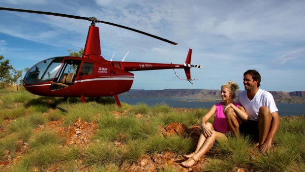  Newly weds touch down atop a high ridge overlooking Lake Argyle.