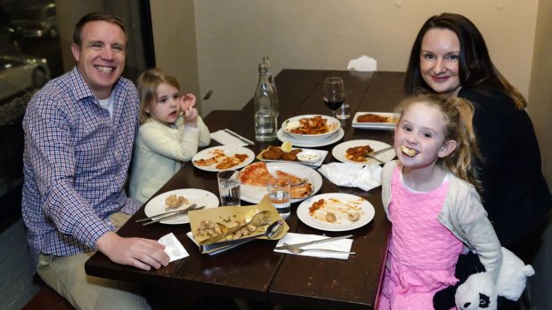David Feeney, wife Lesley Healy and their girls Elsa and Maeve, at La Disfida restaurant in Haberfield, are part of the trend towards dining out early.