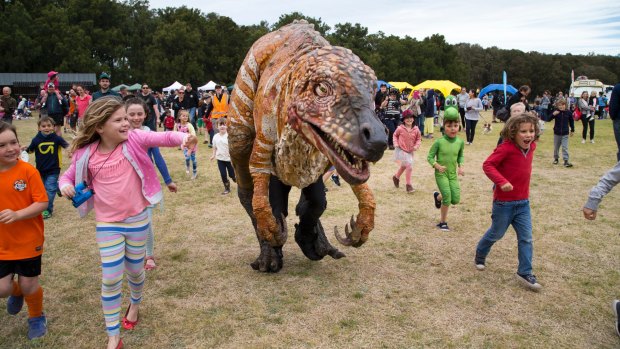 Children and dinosaurs alike enjoyed the warm weekend weather for "Science in the Swamp" at Centennial Park. 