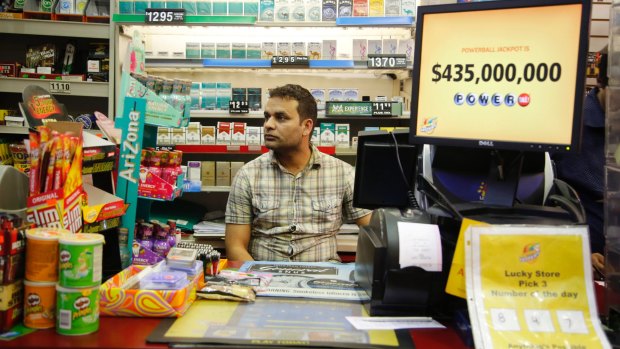 Malik Imran waits for customers at his store in Chicago on Thursday when the Powerball jackpot was still at $US435 million, after more than two months without a winner.