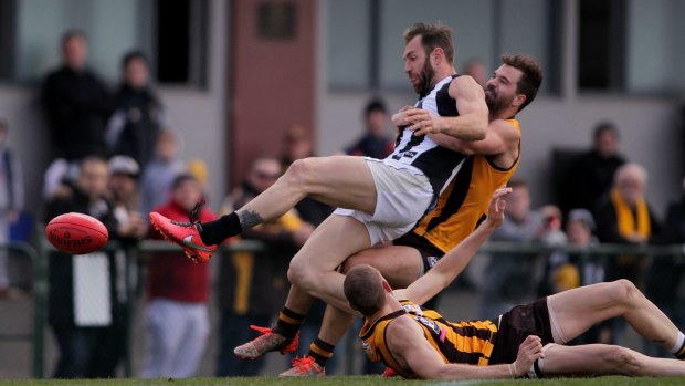 Travis Cloke of Collingwood Magpies gets tackled right in front goals during the round 20 VFL match between the Box Hill Hawks and the Collingwood Magpies at Box Hill City Oval on August 20, 2016