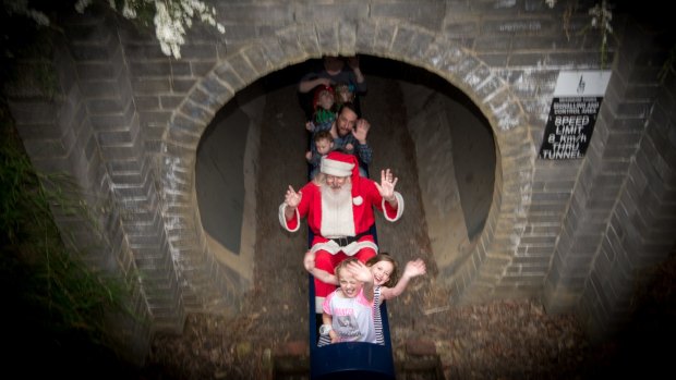 Stephen Fox, as Santa, and children at Kalparrin centre for special needs children's Christmas party.
