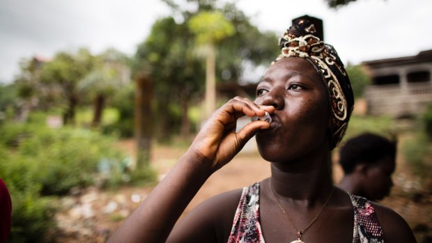 Rebecca Gborie receives an oral cholera vaccination.