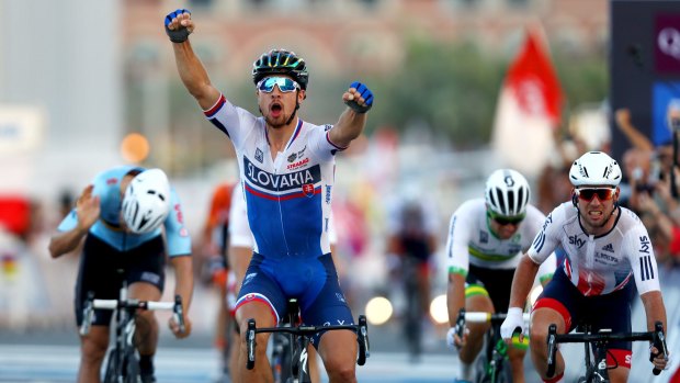 Peter Sagan wins back-to-back men's road race world titles, with Canberra's Michael Matthews, on his right, fourth.