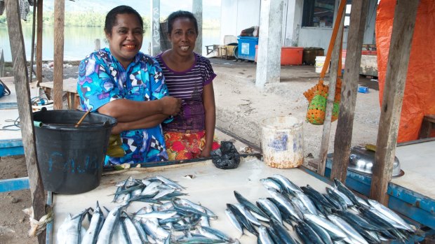 Women selling their catch at Kalabahi market on Alor, Indonesia.
