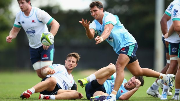 Disappointed: Nick Phipps passes during a Waratahs training session.