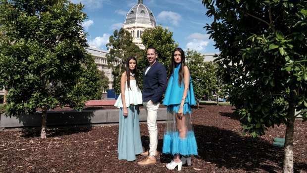 Virgin Australia Melbourne Fashion Festival CEO Graeme Lewsey with bloggers Jess and Stef Dadon, who are wearing designs by RMIT's Alice Kennedy, a finalist in the National Graduate Showcase.