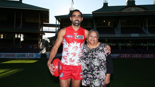 Pride: Adam Goodes, wearing the Sydney Swans Indigenous Round guernsey, poses with his mum and designer of the guernsey, Lisa Sansbury, at Sydney Cricket Ground.