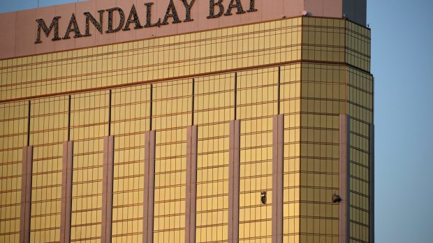 Drapes billow out of broken windows at the Mandalay Bay Resort and Casino. A gunman was found dead inside a hotel room.