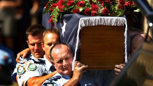Police officers carry Detective Inspector Bryson Anderson's coffin at his funeral at St Patrick's church in Paramatta in December 2012.