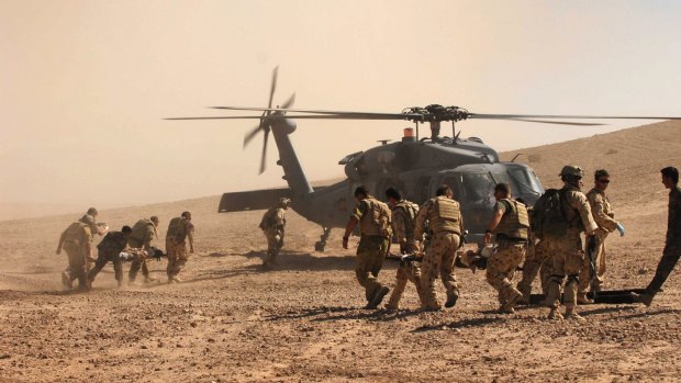Australian and Afghan troops race to evacuate the civilian victims of a Taliban roadside bomb in Oruzgan Province, Afghanistan.

