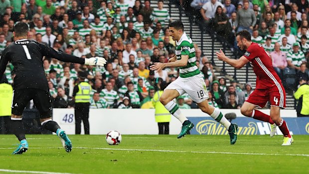 Cool: Rogic outpaces the Aberdeen defence before slotting home the matchwinner.