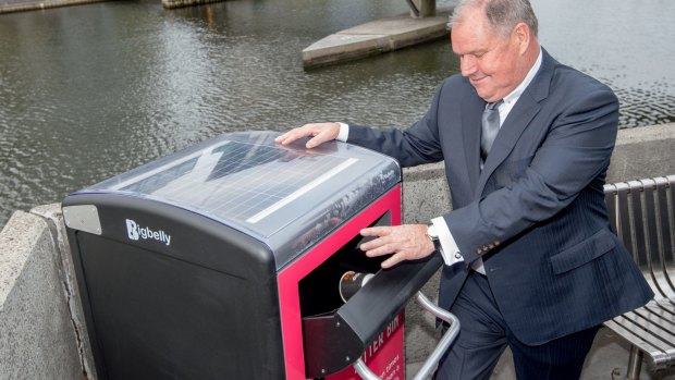Melbourne's lord mayor Robert Doyle with one of six Bigbelly bins recently installed there.