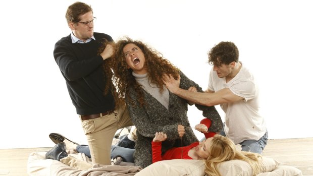 Actors Simon Corfield, left, Maria Angelico, Matt Whitty and Anna Burgess (lying on the ground) play a family at odds with one another in <i>Bad Jews</I>.