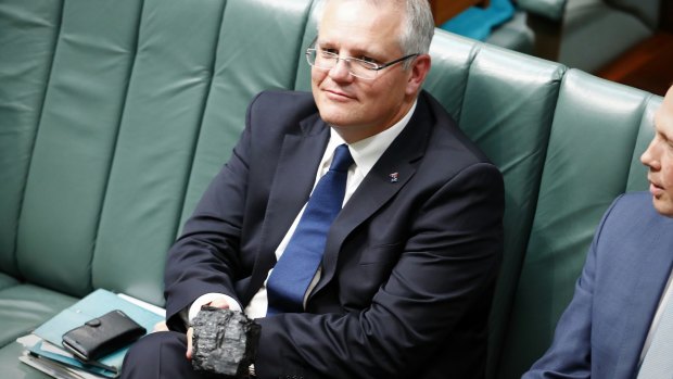 Treasurer Scott Morrison with a lump of coal during question time.