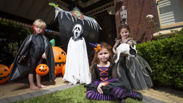 In the spirit: Josh Waite, 3, Lachlan Waite, 5, Alex Gemenis, 6, and Helena Gemenis, 4, prepare for Halloween.