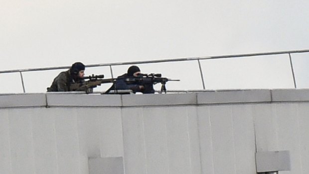 Police marksmen take up position on a roof in Dammartin-en-Goele.
