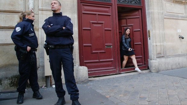 French police officers outside the residence of Kardashian West in Paris following the robbery.