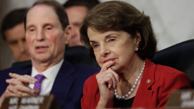 Senator Dianne Feinstein (right) questioned Mr Trump over a deal for "dreamers".