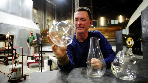 Artist Brian Hirst with some of his pieces that will be on sale at the Winter Glass Market.