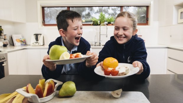 Lucas and Emily Olive enjoy their healthy afternoon tea of fruit rather than sugar-packed snacks.