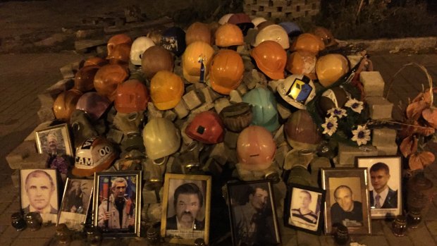 A mound of helmets in Instytutska Street, Kiev, commemorates the dead of 2014.