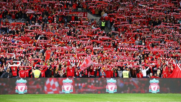See of red: Liverpool fans sing before kick-off.