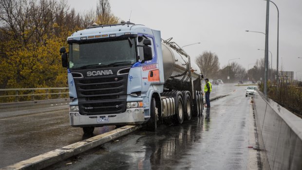 A milk truck stuck on a divider on the Monaro Highway on Wednesday.