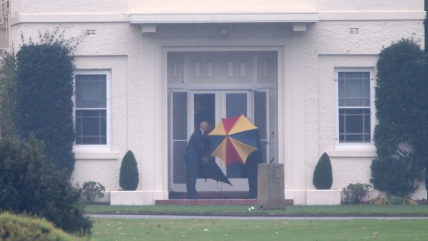 A wet entrance to Government House in Canberra ahead of Malcolm Turnbull's arrival.
