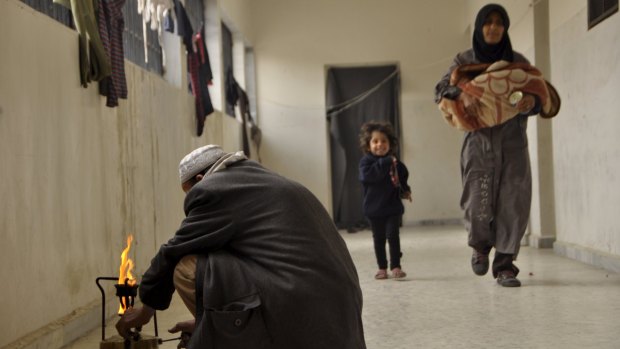 People who fled Yarmouk camp at an abandoned school in the rebel-held town of Yalda, south of Damascus.