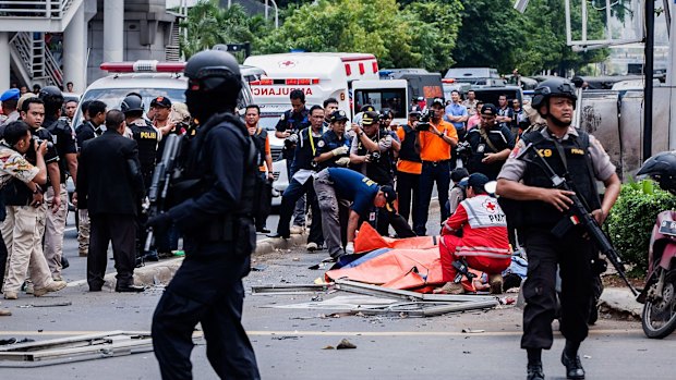 Police at the site of a series of explosions in central Jakarta. 