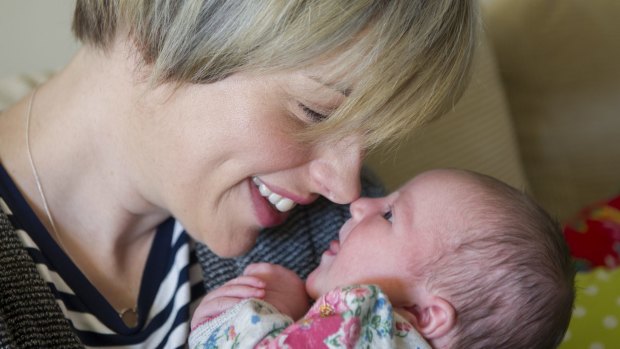 <i>The Voice's</i> Amber Nichols at home in Canberra with new baby Olive.
