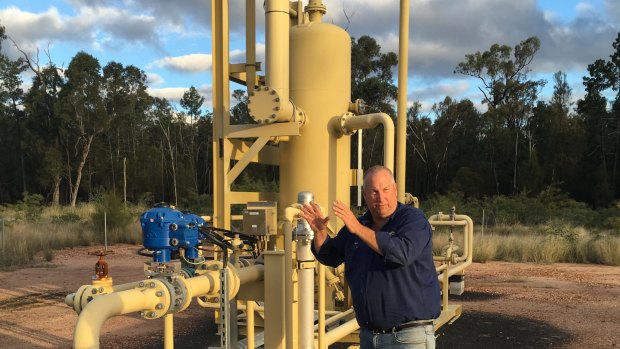 Nood Nothdurft stands in front of CSG equipment on his property.