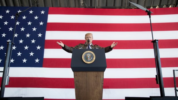 President Donald Trump speaks at a hanger rally at Yokota Air Base in Japan on the first top of his five country trip through Asia. 