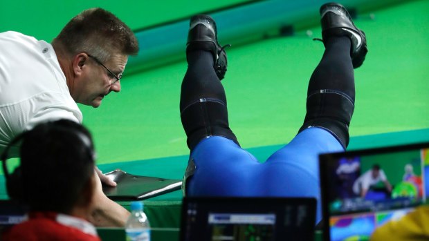 Milko Tokola, of Finland, fell off the stage after successfully completing his lift.