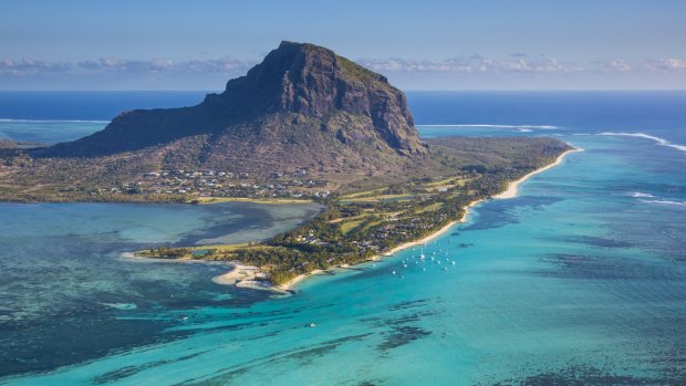 Arriving by air, the turquoise seas and verdant landscape of Mauritius are full of holiday promise.