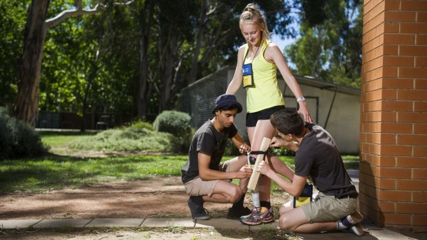 Keshav Kotecha, from Sydney, Abbey Godwin-Smith, from Hostrom, and Matt Dutton, from Adelaide, taking part in a prosthetic leg building exercise at the ANU College of Engineering.  