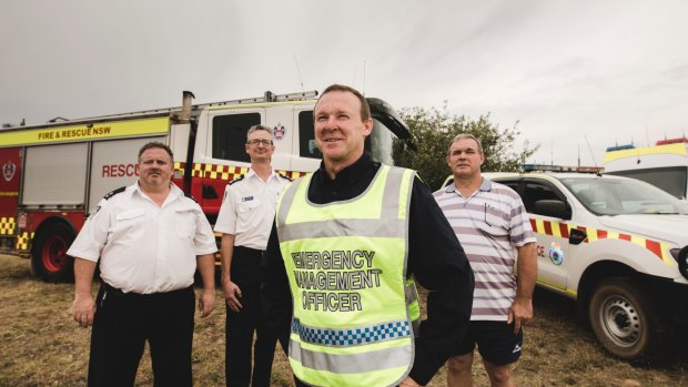 Tim Carroll and  Darren Marks from NSW RFS with NSW Police emergency management officer Paul Lloyd and operations controller Michael Handley.