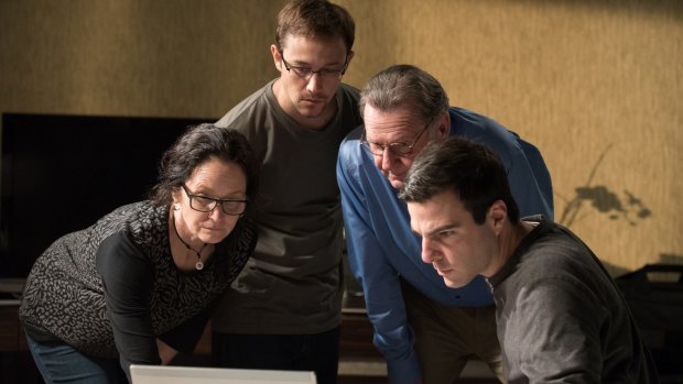 Melissa Leo as Laura Poitras, Joseph Gordon-Levitt as Edward Snowden, Tom Wilkinson as Ewen MacAskill and Zachary Quinto as Glenn Greenwald in a scene from <i>Snowden</i>.