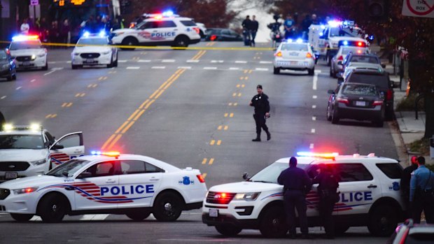 Police secure the scene near Comet Ping Pong in Washington on Sunday.