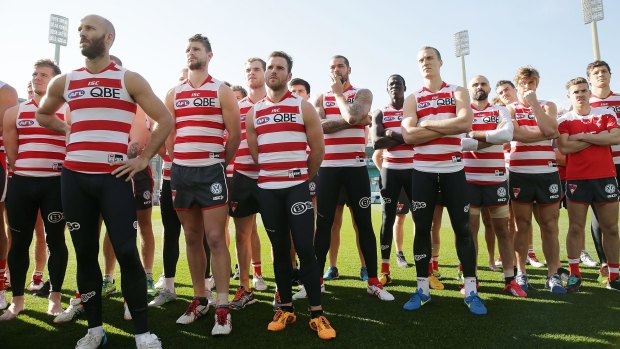 Sydney players stand in solidarity for teammate Adam Goodes.