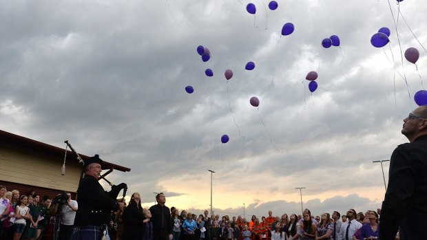 Friends and family release balloons for Gatton teenager Jayde Kendall.