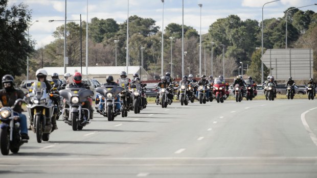 A long convoy of motorbikes makes its way down Northbourne Avenue during the 2017 Wall to Wall Ride for Remembrance.
