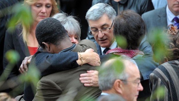 Ian and Sue Jones consoled at their children's funeral 