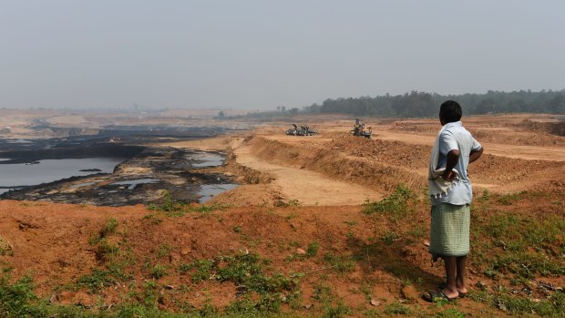 A Gonds tribesman looks over central India’s Parsa East and Kante Basan coal mine. Operated by Adani, the mine has had a severe impact on the local environment. 