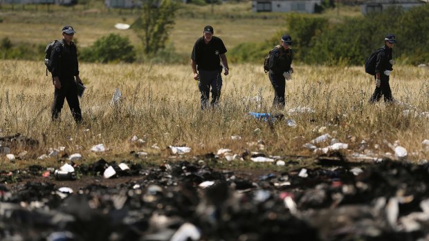 Australian Federal Police and their Dutch counterparts searching at the MH17 crash site.