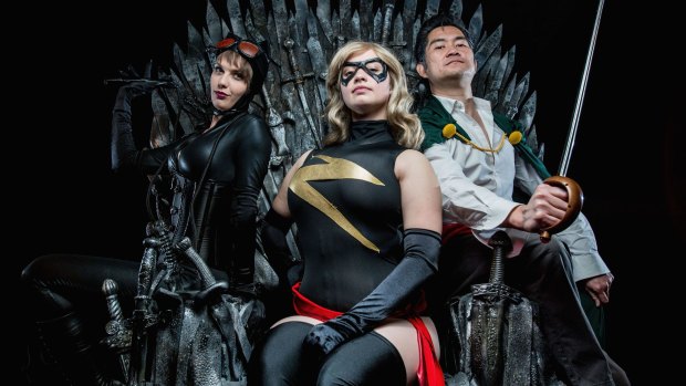 Cosplayers Black Cat, Ardella and Chewie Chan sit on the Iron Throne ahead of Free Comic Book Day.